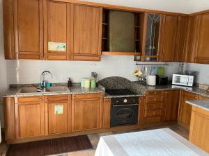 Kuchyň nebo kuchyňský kout v ubytování Grandi Cime Guest House