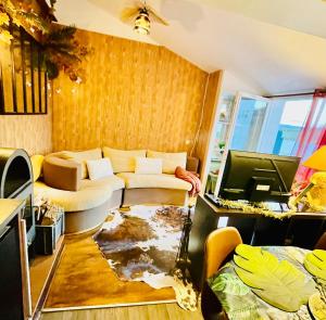 a living room with a couch and a table at Maison DonaSete T3 in Vieille-Brioude