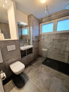 Ванна кімната в Hafenblick Apartment - Central