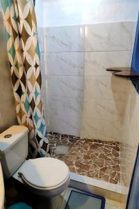 a bathroom with a toilet and a shower at Pousada Maravilha in Itacaré +22 photos