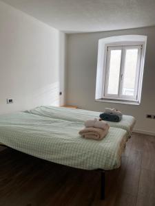 Postel nebo postele na pokoji v ubytování Domus Laita