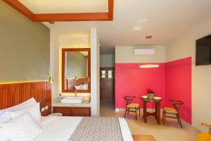 Postel nebo postele na pokoji v ubytování Hotel Poquito a Poquito