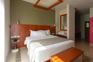 Postel nebo postele na pokoji v ubytování Hotel Poquito a Poquito