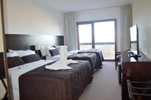 Cama ou camas em um quarto em View Hotel BRC