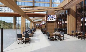 a restaurant with tables and chairs in a building at Snoqualmie Casino & Hotel in Snoqualmie
