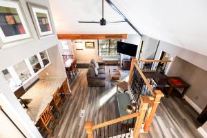 an overhead view of a living room and dining room at Hidden Creek Canyons Retreat, Alpine Charm, Private Hot Tub, Sleeps 8, Cozy Fireplace, in Park City