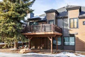 a house with a deck on the side of it at Hidden Creek Canyons Retreat, Alpine Charm, Private Hot Tub, Sleeps 8, Cozy Fireplace, in Park City