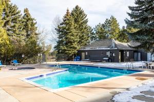 a swimming pool in a yard with a house at Hidden Creek Canyons Retreat, Alpine Charm, Private Hot Tub, Sleeps 8, Cozy Fireplace, in Park City