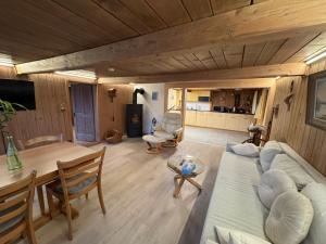 a living room with a couch and a table at Meieli's Chalet in Hofstetten 