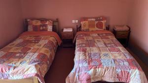 Postel nebo postele na pokoji v ubytování Riad Bouchahoud Hotel in Telouet