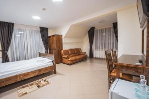 Postel nebo postele na pokoji v ubytování Hotel Rabbit Bran