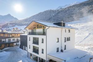 an aerial view of a building in the snow at Apart Sonnenbichl in Sölden