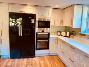 Kuchyň nebo kuchyňský kout v ubytování The Old Coach House