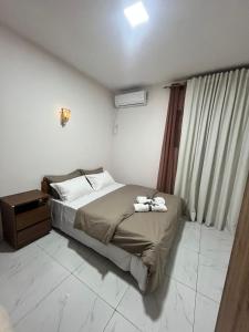 Giường trong phòng chung tại Nayuha Buildings Apt B2