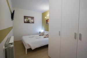 Postel nebo postele na pokoji v ubytování Gelsomino Suite Leonardo Academy, MXP & Laghi