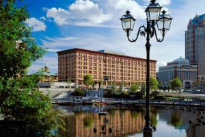 a street light in front of a building next to a river at Courtyard Providence Downtown in Providence