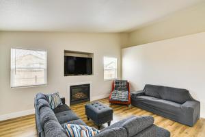 a living room with two couches and a tv at 1 Mi to Pioneer Crossing Casino Fernley Retreat! in Fernley