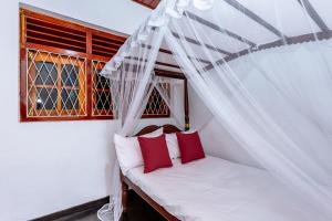 Katil atau katil-katil dalam bilik di Villa Omega