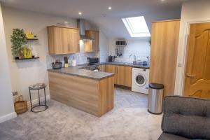 a kitchen with a sink and a counter top at Lethbridge Villa 49 Apartment 3 Super Fibre WiFi, Free parking in Southport