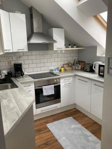 Kuchyňa alebo kuchynka v ubytovaní Esztergom apartman