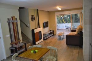 a living room with a couch and a table at El huerto de la Dominga in Segovia