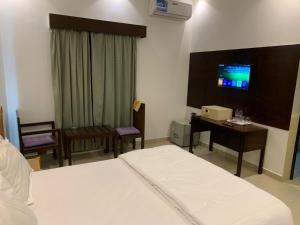 Postel nebo postele na pokoji v ubytování sun rise hotel راس الخيمة