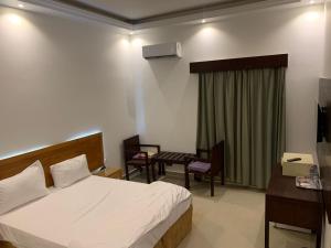 Postel nebo postele na pokoji v ubytování sun rise hotel راس الخيمة