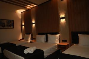 A bed or beds in a room at Istanbul Bakirkoy Rays Port Hotel City Center