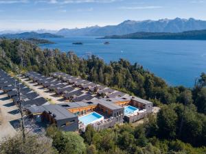an aerial view of a resort with a lake at Montaña Resort in Villa La Angostura