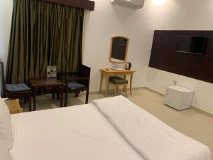 Postel nebo postele na pokoji v ubytování sun rise hotel راس الخيمة