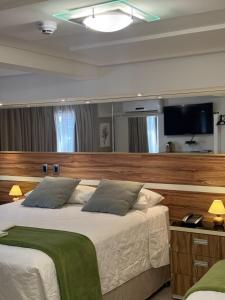 Postel nebo postele na pokoji v ubytování Hotel Imperatriz