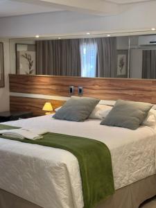 Postel nebo postele na pokoji v ubytování Hotel Imperatriz