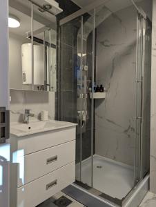 a bathroom with a shower and a sink at Kod Strica in Kopaonik
