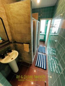 a bathroom with a sink and a shower at Art & Culture Panevėžys in Panevėžys +16 photos