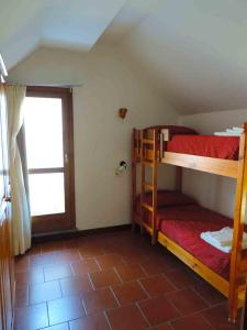 En eller flere senge i et værelse på appartamento in Residence Cervinia due