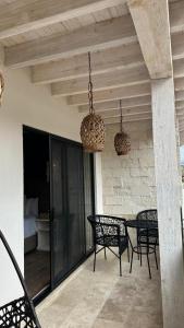 a patio with chairs and a table and lights at Altamonte Hotel Boutique in Bernal +80 photos