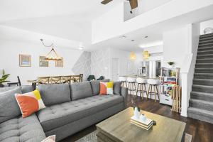 a living room and kitchen with a couch and a table at Large Pool, Near the Beach, 5 Bedroom, King Beds, Patio, Grill, Pet Friendly in Corpus Christi