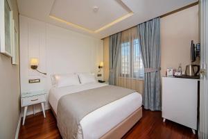 Ένα ή περισσότερα κρεβάτια σε δωμάτιο στο Ada Karakoy Hotel - Special Category