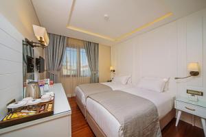 Ένα ή περισσότερα κρεβάτια σε δωμάτιο στο Ada Karakoy Hotel - Special Category