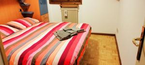 Postel nebo postele na pokoji v ubytování Appartamento di Giulio & Giorgia