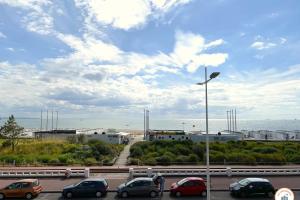 a parking lot with cars parked on a highway at Le Cosy - Vue Mer - Parking - Balcon in Le Havre