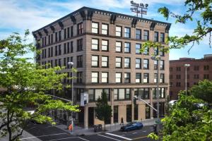 a large brick building on a city street at Upscale Apartment Suite - Close to Everything in Spokane
