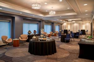 a ballroom with tables and chairs in a room at Courtyard by Marriott Toronto Downtown in Toronto