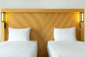 Postel nebo postele na pokoji v ubytování Courtyard by Marriott Tbilisi