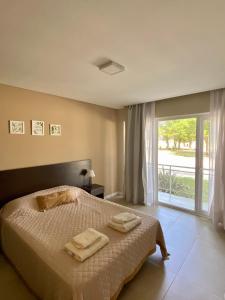 Ένα ή περισσότερα κρεβάτια σε δωμάτιο στο Suites en Complejo Rincón del Sol
