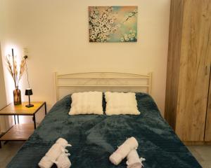 a bedroom with two stuffed animals on a bed at Bill and Dim in Xrisoupoli in Chrysoupolis