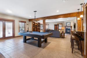 a living room with a pool table in it at Wolf Ridge Lodge in Boone