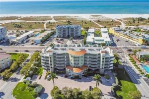 an aerial view of a resort near the beach at Comfort & Style for the Ultimate Beach Getaway in St Pete Beach