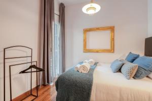 Posteľ alebo postele v izbe v ubytovaní Sweett - Comte Urgell + 7 fotografií
