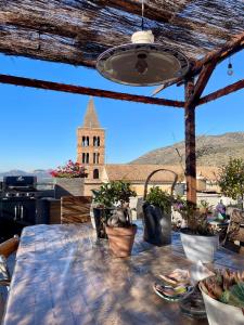 a dining table with a view of a church at Il Campanile in Tivoli